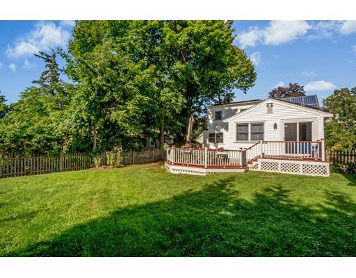 68 Harding Road Lexington, MA 02420 - Photo 36 of 41 a view of a house with a backyard porch and sitting area