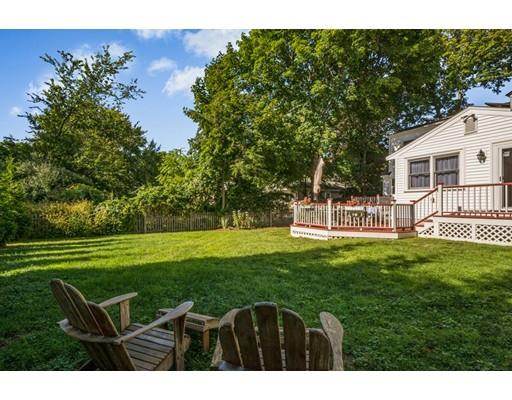 68 Harding Road Lexington, MA 02420 - Photo 37 of 41 a backyard of a house with table and chairs