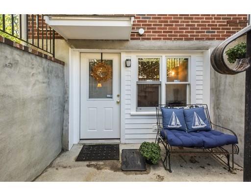 68 Harding Road Lexington, MA 02420 - Photo 41 of 41 a view of a porch with a table and chairs