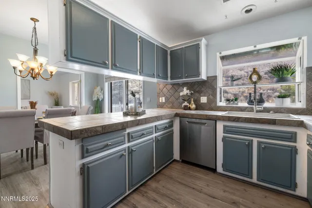 a kitchen that has a lot of cabinets in it