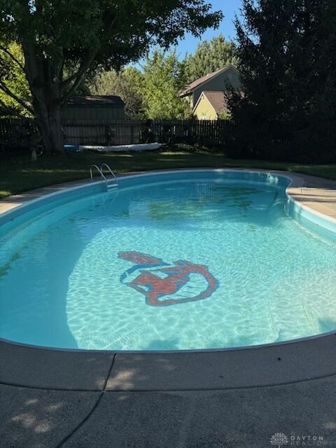 9964 Hummingbird Way Dayton, OH 45458 - Photo 4 of 57 Relax and unwind in this inviting backyard oasis featuring a refreshing swimming pool.