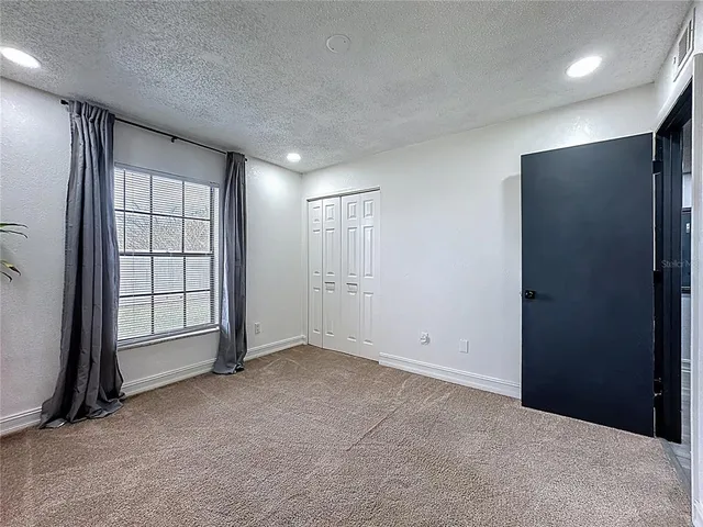 a bathroom with a shower and a window