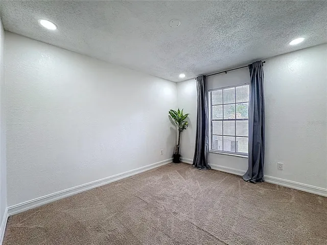 an aerial view of house with swimming pool outdoor seating and yard
