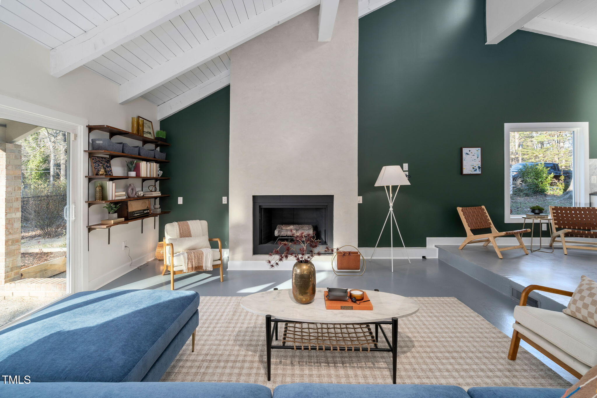 110 Continental Drive Durham, NC 27712 - Photo 20 of 51 a living room with furniture a fireplace and a large window