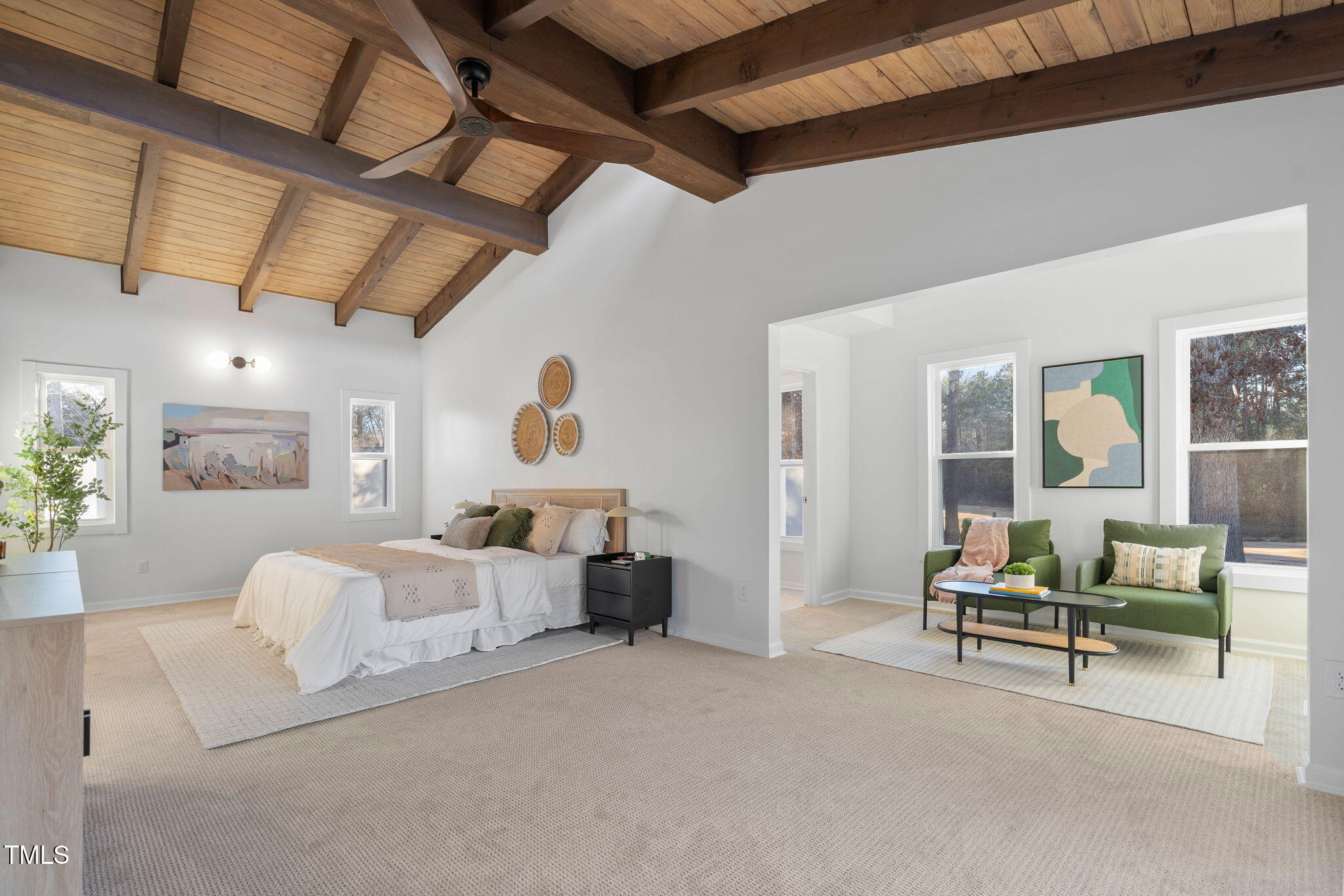 110 Continental Drive Durham, NC 27712 - Photo 32 of 51 a living room with furniture and a chandelier
