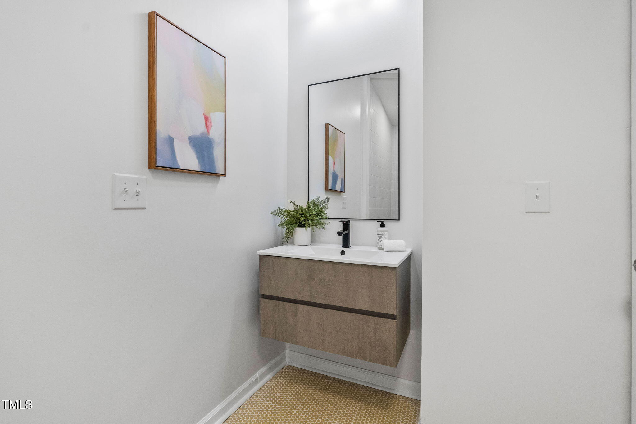 110 Continental Drive Durham, NC 27712 - Photo 34 of 51 a bathroom with a sink and a mirror