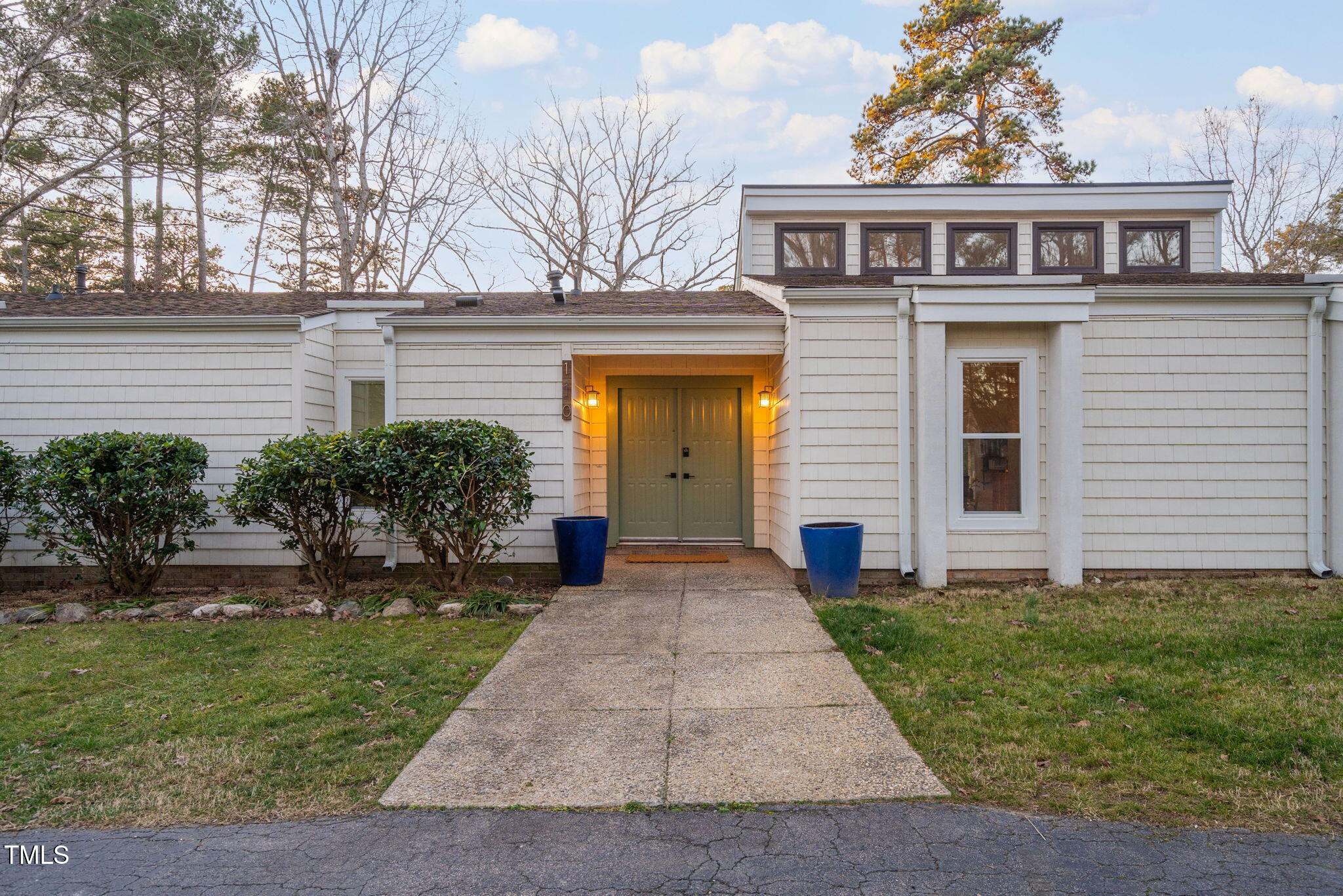 110 Continental Drive Durham, NC 27712 - Photo 7 of 51 a front view of a house with garden