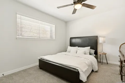 a bedroom with a bed and window