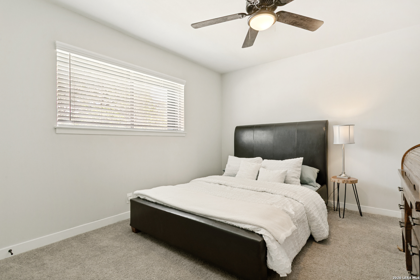 102 Silver Spring Universal City, TX 78148 - Photo 22 of 36 a bedroom with a bed and window