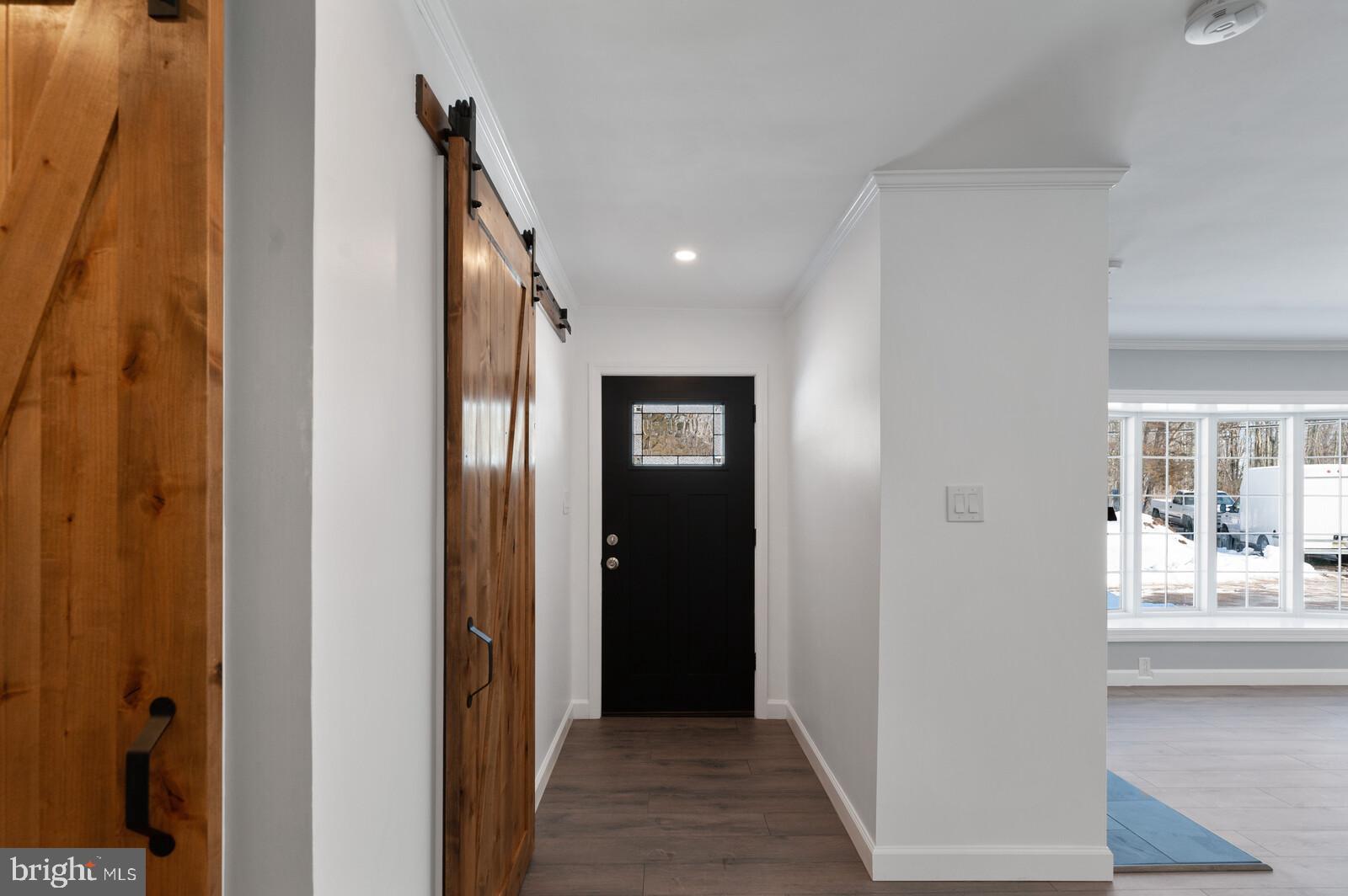 303 Carter Road Princeton, NJ 08540 - Photo 3 of 25 Entryway with wood barn door closet