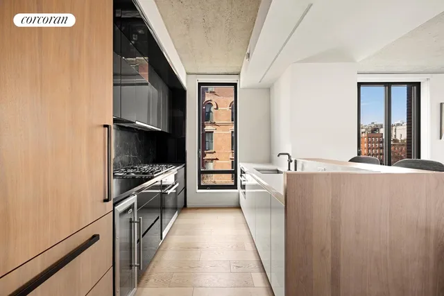 a kitchen with stainless steel appliances a refrigerator and a stove