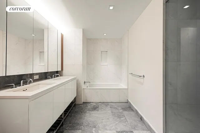 a bathroom with a bathtub and a sink