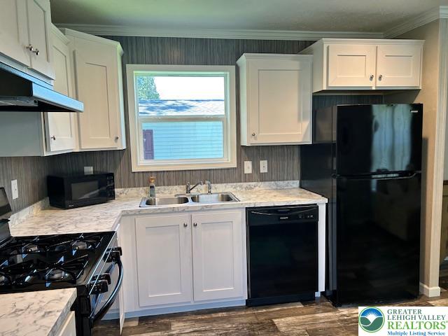 8220 Airport Road, Unit TRLR 17 Bath, PA 18014 - Photo 12 of 25 a kitchen with stainless steel appliances granite countertop a sink stove and refrigerator