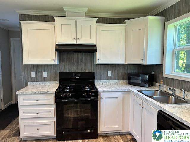 8220 Airport Road, Unit TRLR 17 Bath, PA 18014 - Photo 13 of 25 a kitchen with granite countertop white cabinets and black stainless steel appliances