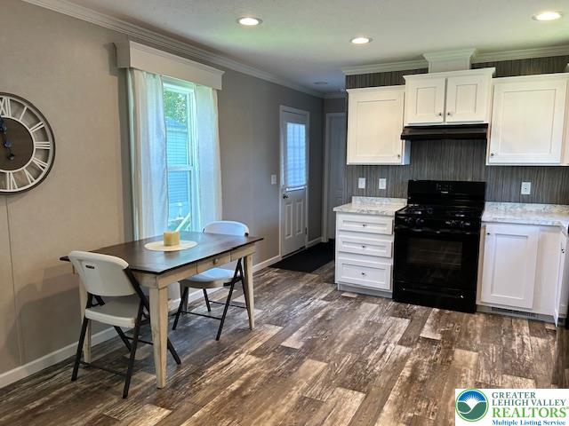 8220 Airport Road, Unit TRLR 17 Bath, PA 18014 - Photo 15 of 25 a kitchen with stainless steel appliances granite countertop a stove a refrigerator a sink a dining table and chairs with wooden floor