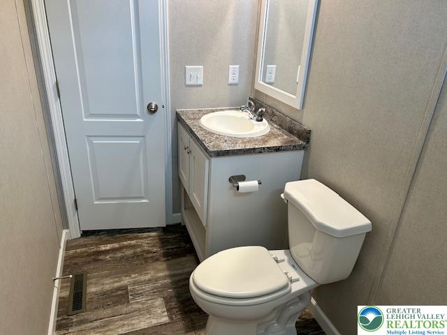 8220 Airport Road, Unit TRLR 17 Bath, PA 18014 - Photo 19 of 25 a bathroom with a toilet sink and mirror