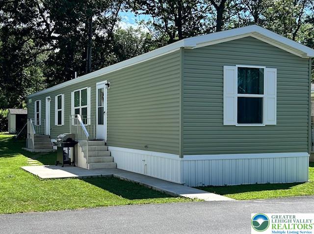 8220 Airport Road, Unit TRLR 17 Bath, PA 18014 - Photo 2 of 25 a view of a house with a yard