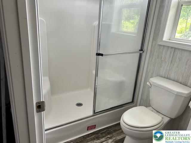8220 Airport Road, Unit TRLR 17 Bath, PA 18014 - Photo 23 of 25 a white toilet sitting next to a shower