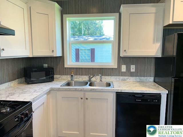 8220 Airport Road, Unit TRLR 17 Bath, PA 18014 - Photo 10 of 25 a kitchen with a sink stove and cabinets