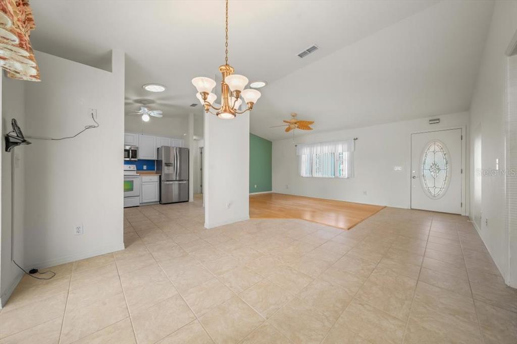 6145 Southwest 100th Loop Ocala, FL 34476 - Photo 13 of 54 a view of a kitchen with a sink and refrigerator
