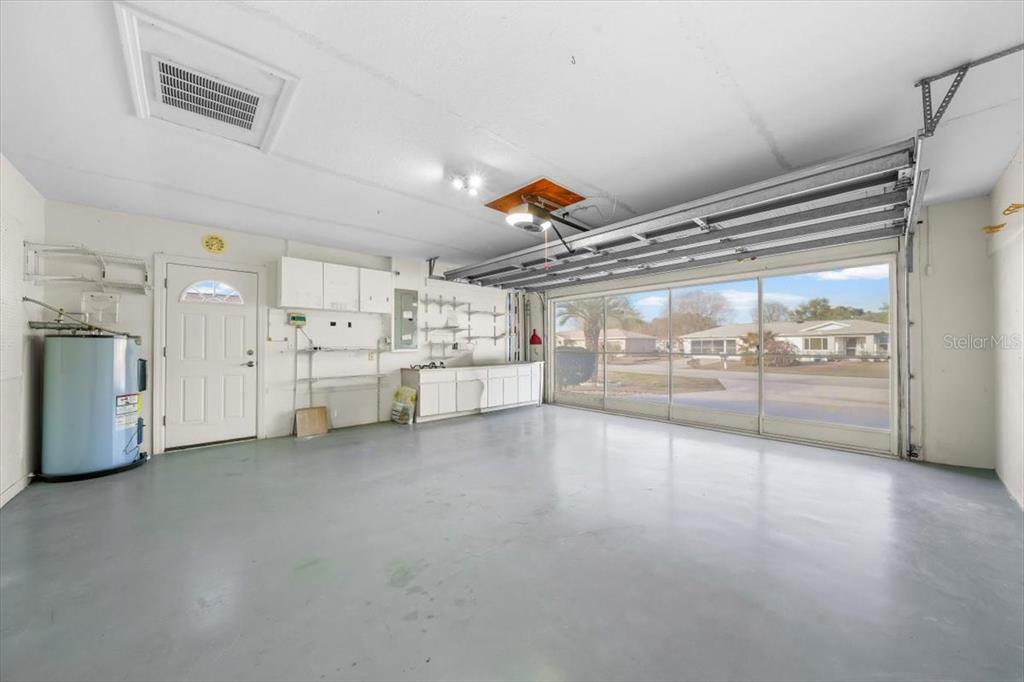 6145 Southwest 100th Loop Ocala, FL 34476 - Photo 20 of 54 a view of a storage & utility room with lots of appliances