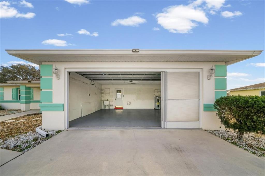 6145 Southwest 100th Loop Ocala, FL 34476 - Photo 21 of 54 a view of a big room with windows and outdoor space