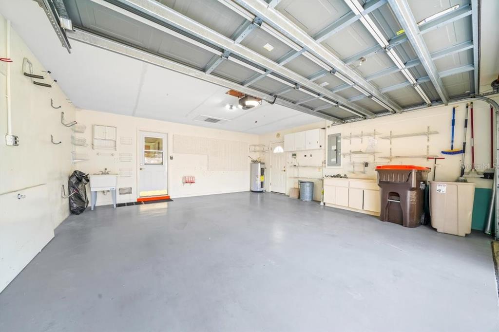 6145 Southwest 100th Loop Ocala, FL 34476 - Photo 22 of 54 a view of a storage & utility room with lots of wooden furniture
