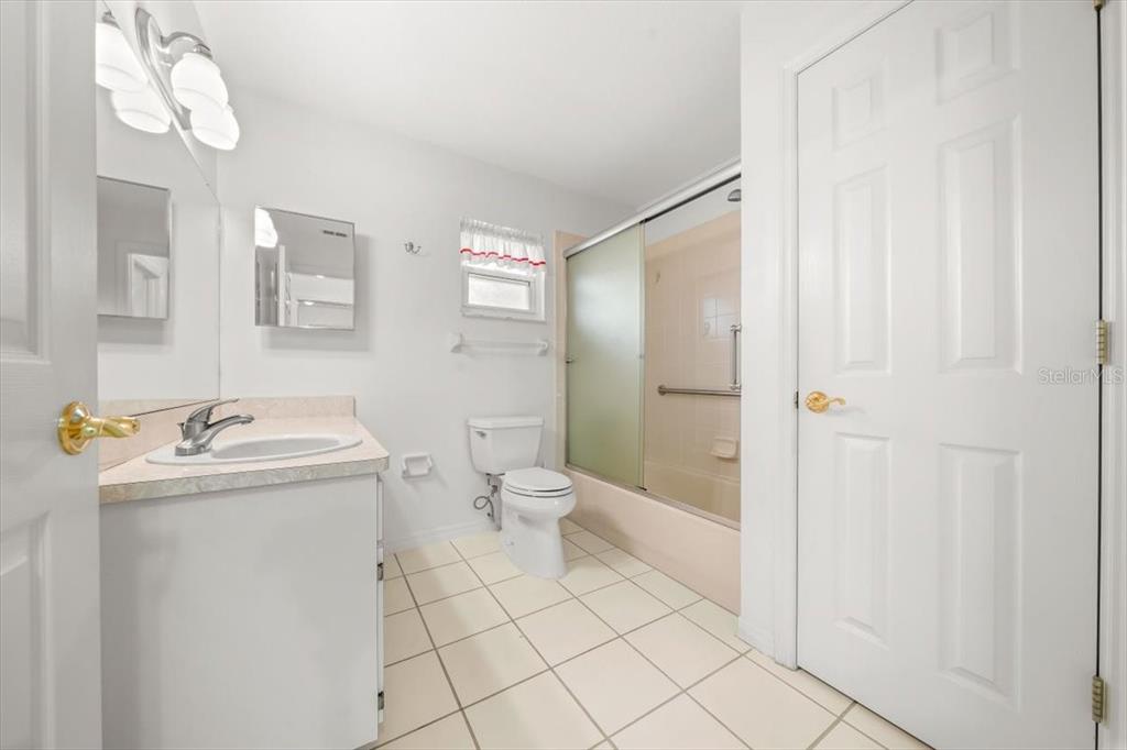 6145 Southwest 100th Loop Ocala, FL 34476 - Photo 25 of 54 a bathroom with a sink a toilet and shower