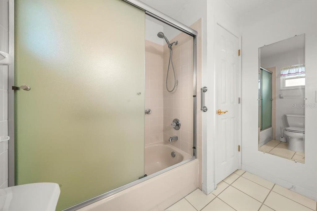 6145 Southwest 100th Loop Ocala, FL 34476 - Photo 27 of 54 a bathroom with a bathtub and a shower