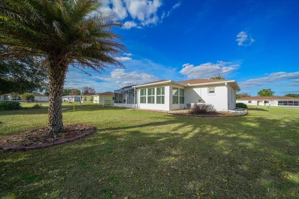 6145 Southwest 100th Loop Ocala, FL 34476 - Photo 44 of 54 a view of a house with a yard