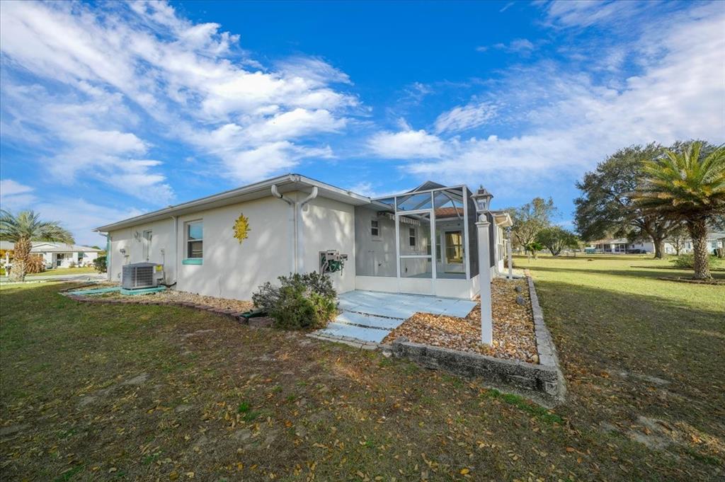 6145 Southwest 100th Loop Ocala, FL 34476 - Photo 48 of 54 a front view of a house with garden