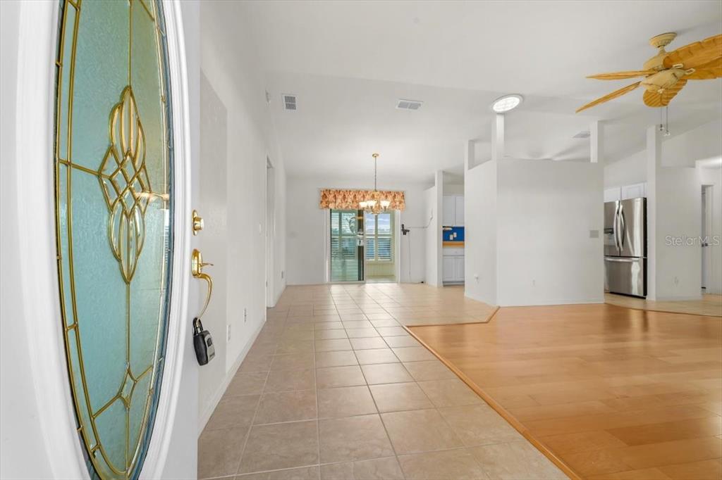 6145 Southwest 100th Loop Ocala, FL 34476 - Photo 7 of 54 a view of an entryway with wooden floor