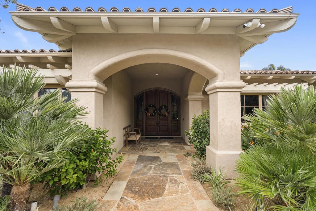 7098 Via Monalex Rancho Santa Fe, CA 92067 - Photo 4 of 5 a front view of a house with garden