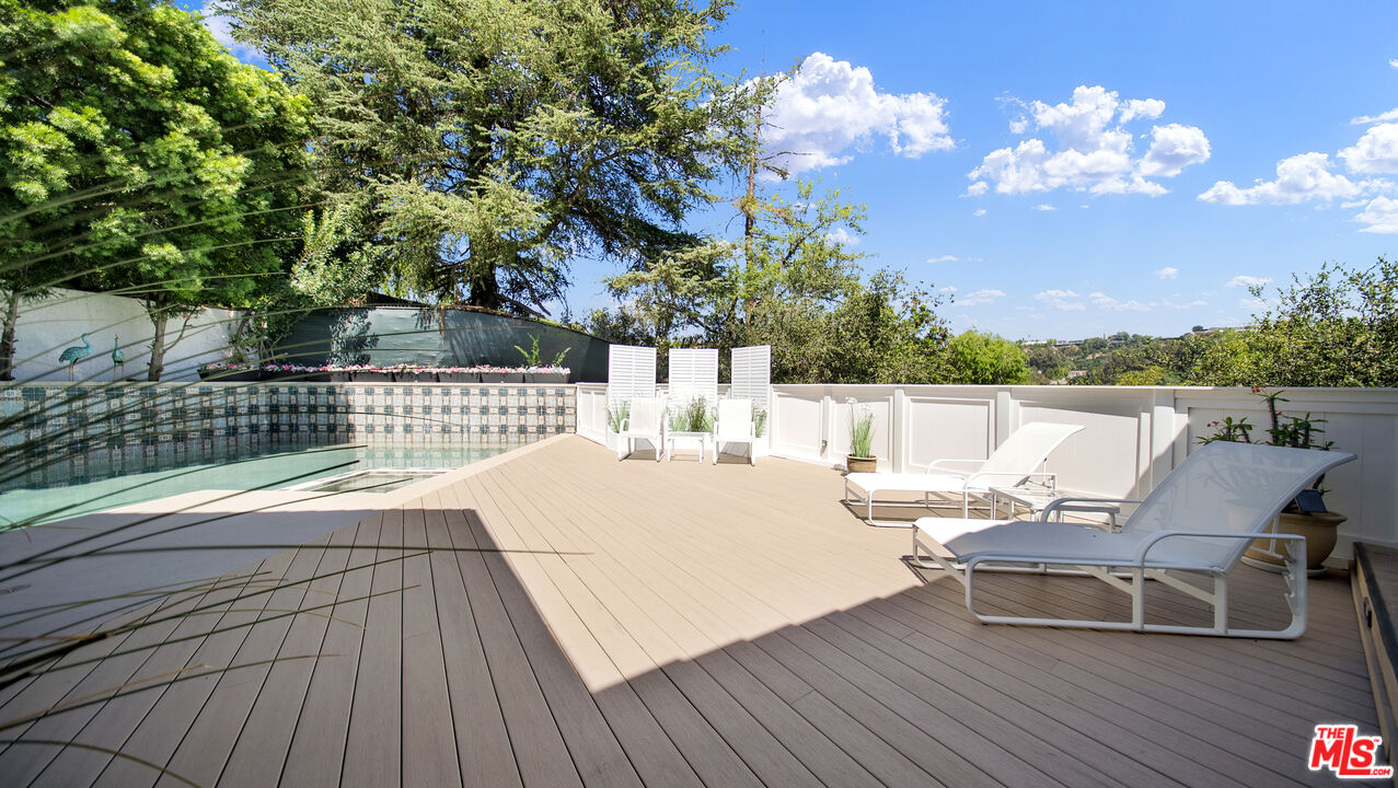 2312 Kimridge Road Beverly Hills, CA 90210 - Photo 14 of 60 a view of a terrace with furniture
