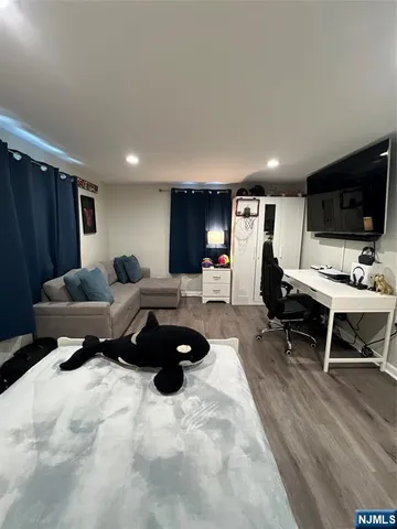 a living room with furniture and a lamp