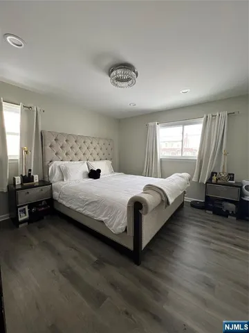 a bathroom with a shower a toilet and a sink