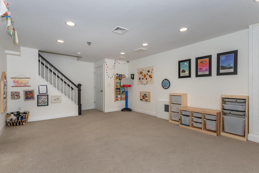 59 Endicott Street, Unit 59 Canton, MA 02021 - Photo 16 of 20 a living room with furniture and a flat screen tv