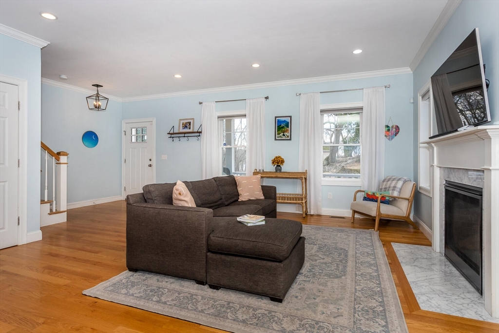 59 Endicott Street, Unit 59 Canton, MA 02021 - Photo 4 of 20 a living room with furniture and a fireplace