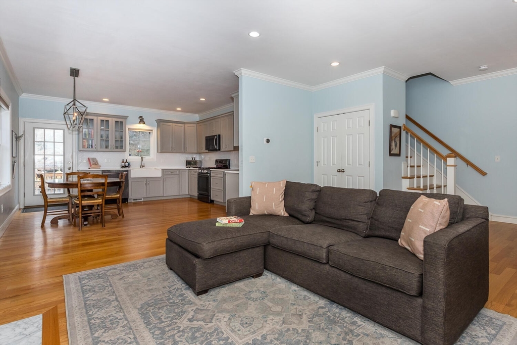 59 Endicott Street, Unit 59 Canton, MA 02021 - Photo 5 of 20 a living room with furniture and kitchen view