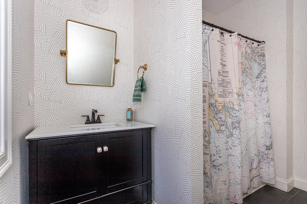 59 Endicott Street, Unit 59 Canton, MA 02021 - Photo 9 of 20 a bathroom with a sink a toilet and mirror