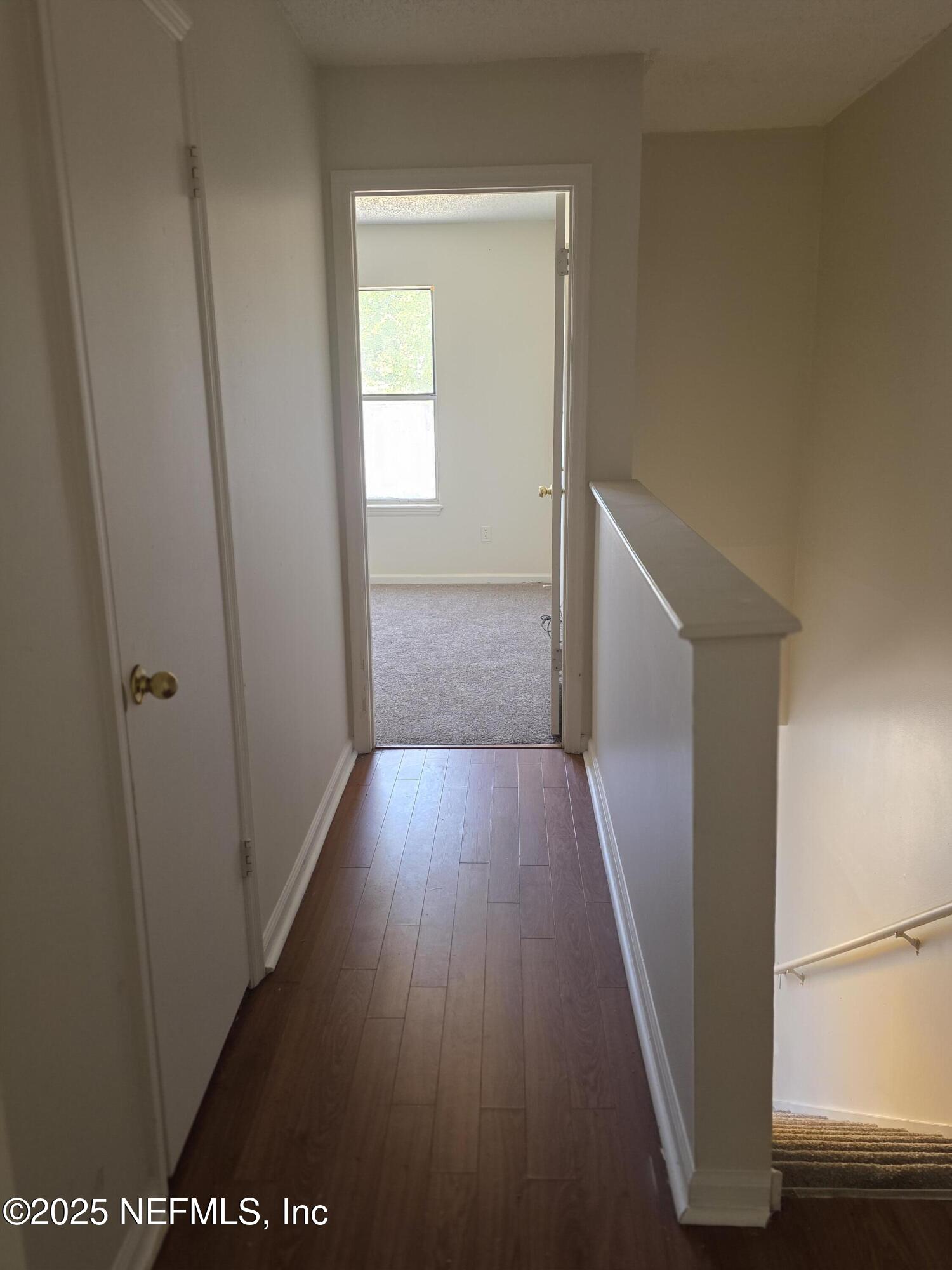 4641 Barnes Road South Jacksonville, FL 32207 - Photo 4 of 12 a view of hallway with wooden floor