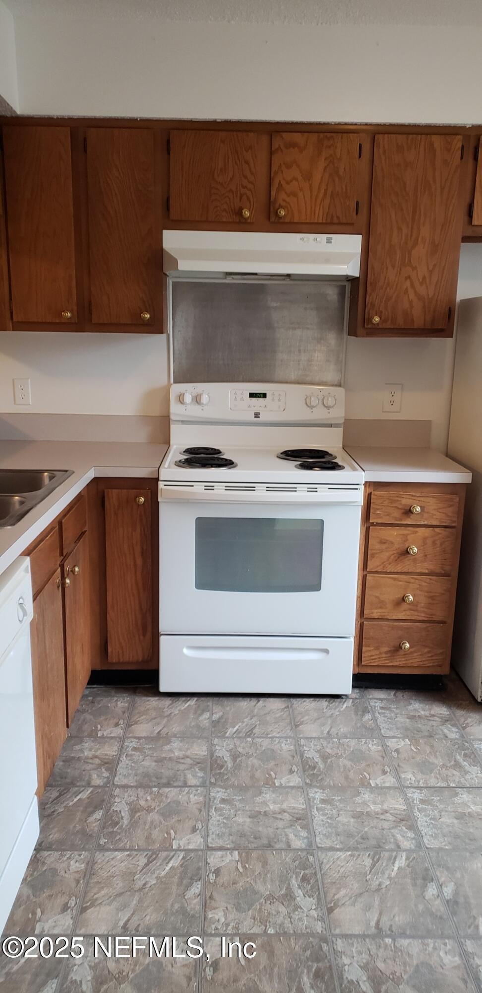 4641 Barnes Road South Jacksonville, FL 32207 - Photo 9 of 12 a stove top oven sitting inside of a kitchen