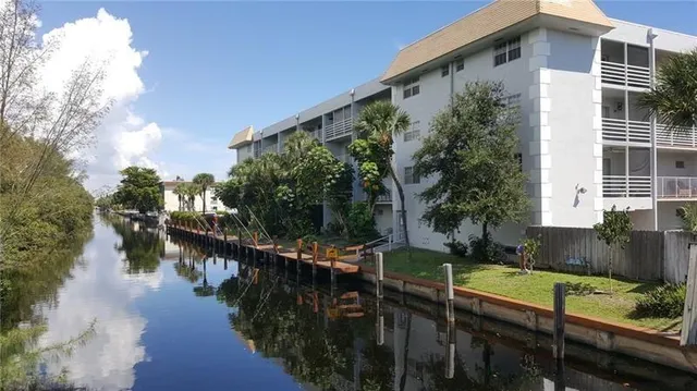 a view of a chairs and tables in the back yard of the house