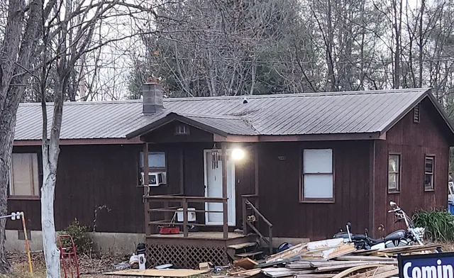 a view of house with outdoor space