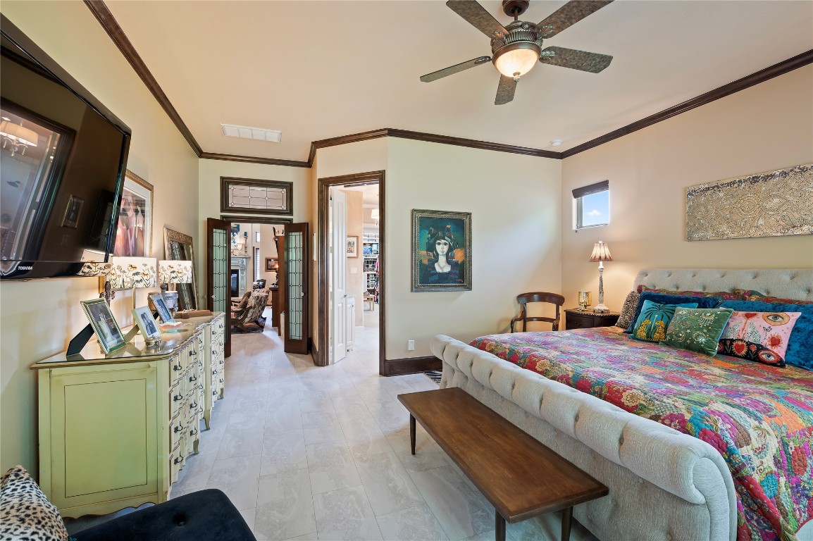 2201 Water Way Seabrook, TX 77586 - Photo 19 of 48 This cozy primary bedroom features double doors that lead to the bright and airy primary bathroom.