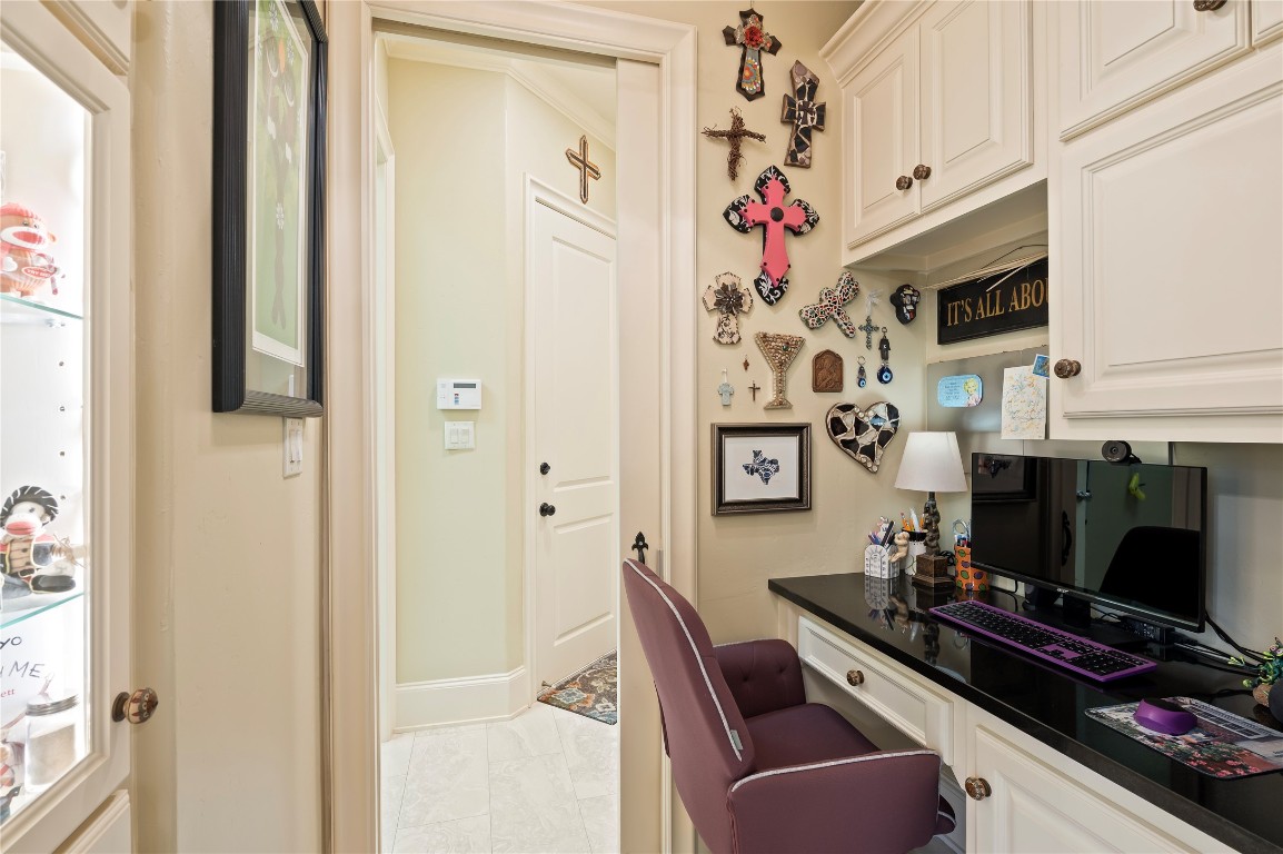 2201 Water Way Seabrook, TX 77586 - Photo 26 of 48 This cozy nook features a built-in desk with a sleek black countertop and ample storage for all your home office needs,