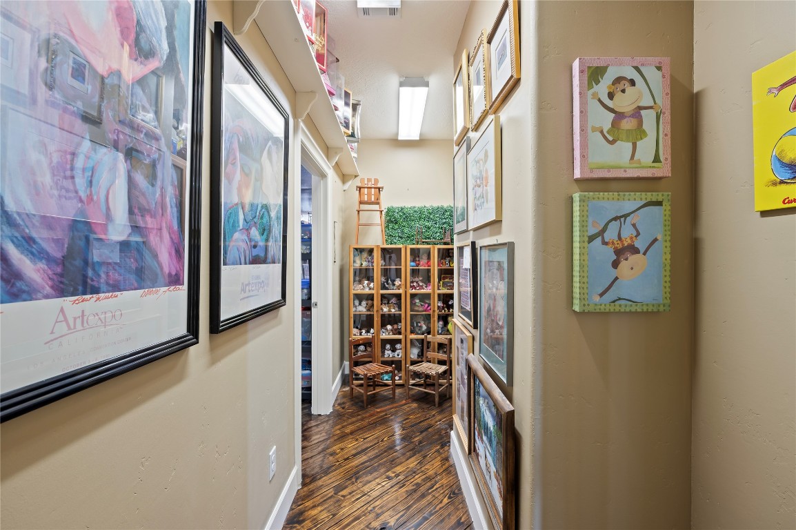 2201 Water Way Seabrook, TX 77586 - Photo 32 of 48 This hallway can function as an office, playroom or whatever your needs see fit and it leads to the climate-controlled storage area.