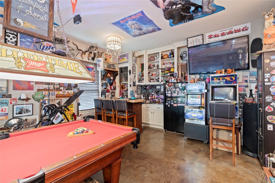 2201 Water Way Seabrook, TX 77586 - Photo 34 of 48 This room is a vibrant and eclectic entertainment space, Ideal for hosting and leisure activities.