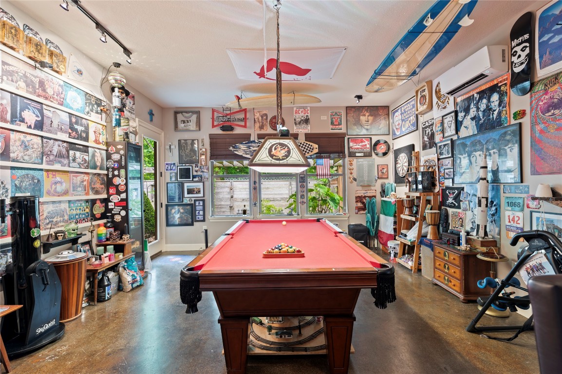 2201 Water Way Seabrook, TX 77586 - Photo 35 of 48 The space is well-lit with modern track lighting and has windows that offer natural light. Ideal for entertainment and showcasing personal collections.