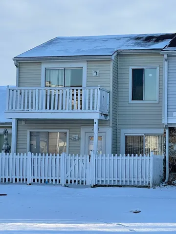a view of a house with a small yard